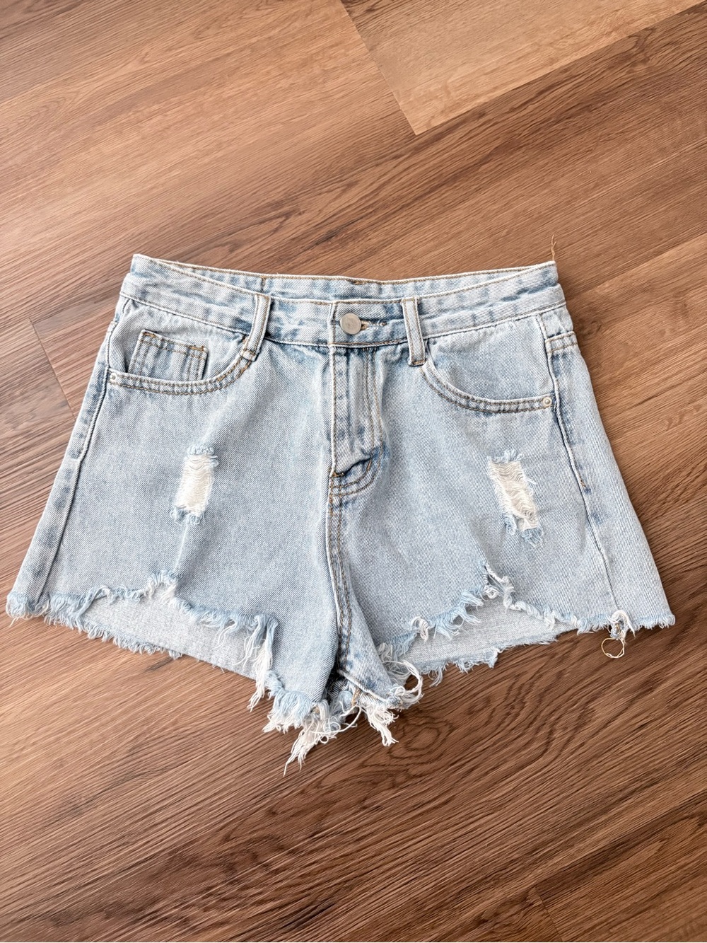 High-Rise Light Blue Distressed Denim Shorts
